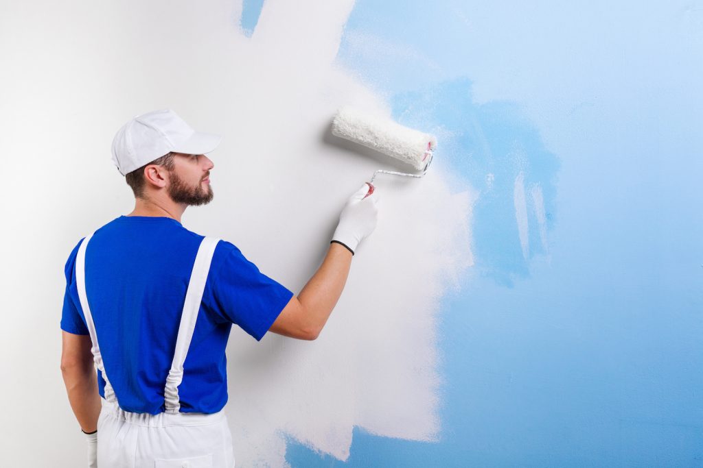 painter in white dungarees, blue t shirt